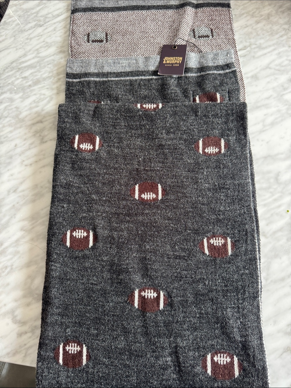 Johnston & Murphy Reversible knit football pattern wool blend gray scarf. NWT.